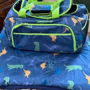 Dinosaur Print Blue Duffle Bag with Green Accents and Sleeping Bag